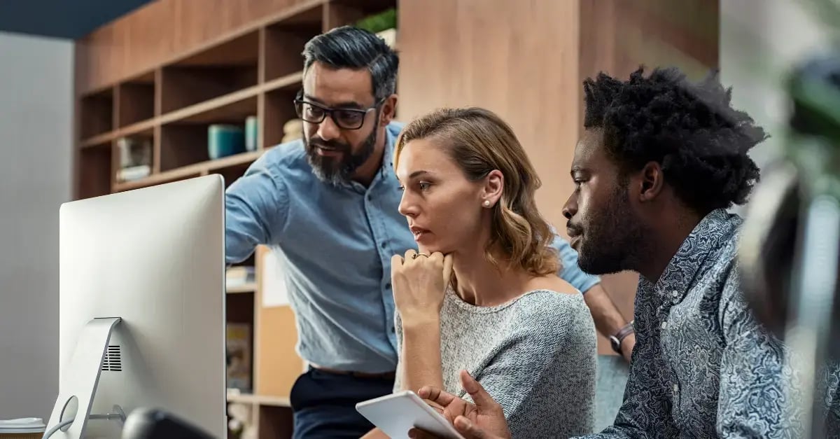 A female and male employees discussing a cloud finops project within a company